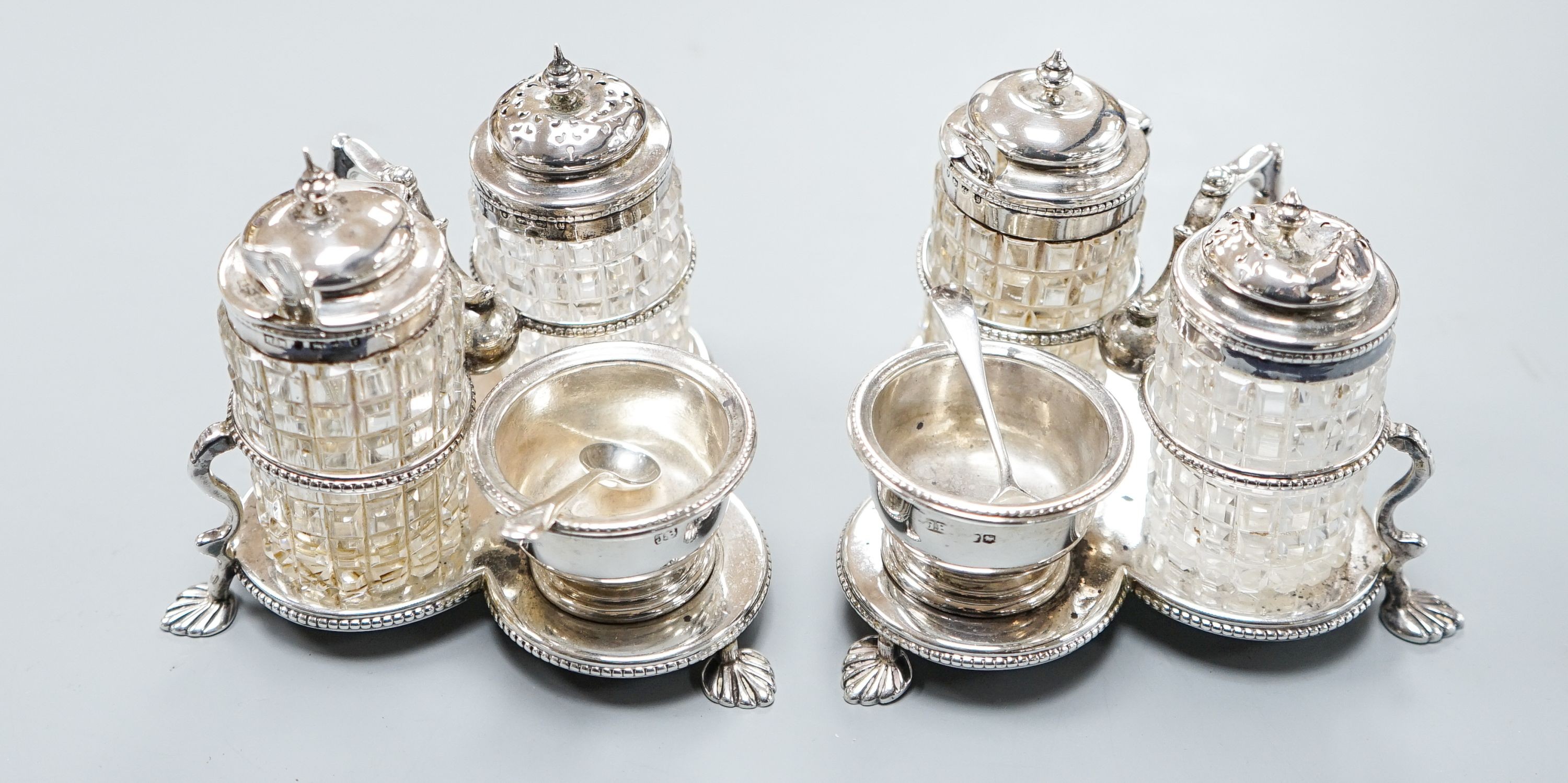 A pair of Victorian silver cruet stands, each with three cruets, Jane Brownett, London, 1880, height 85mm.